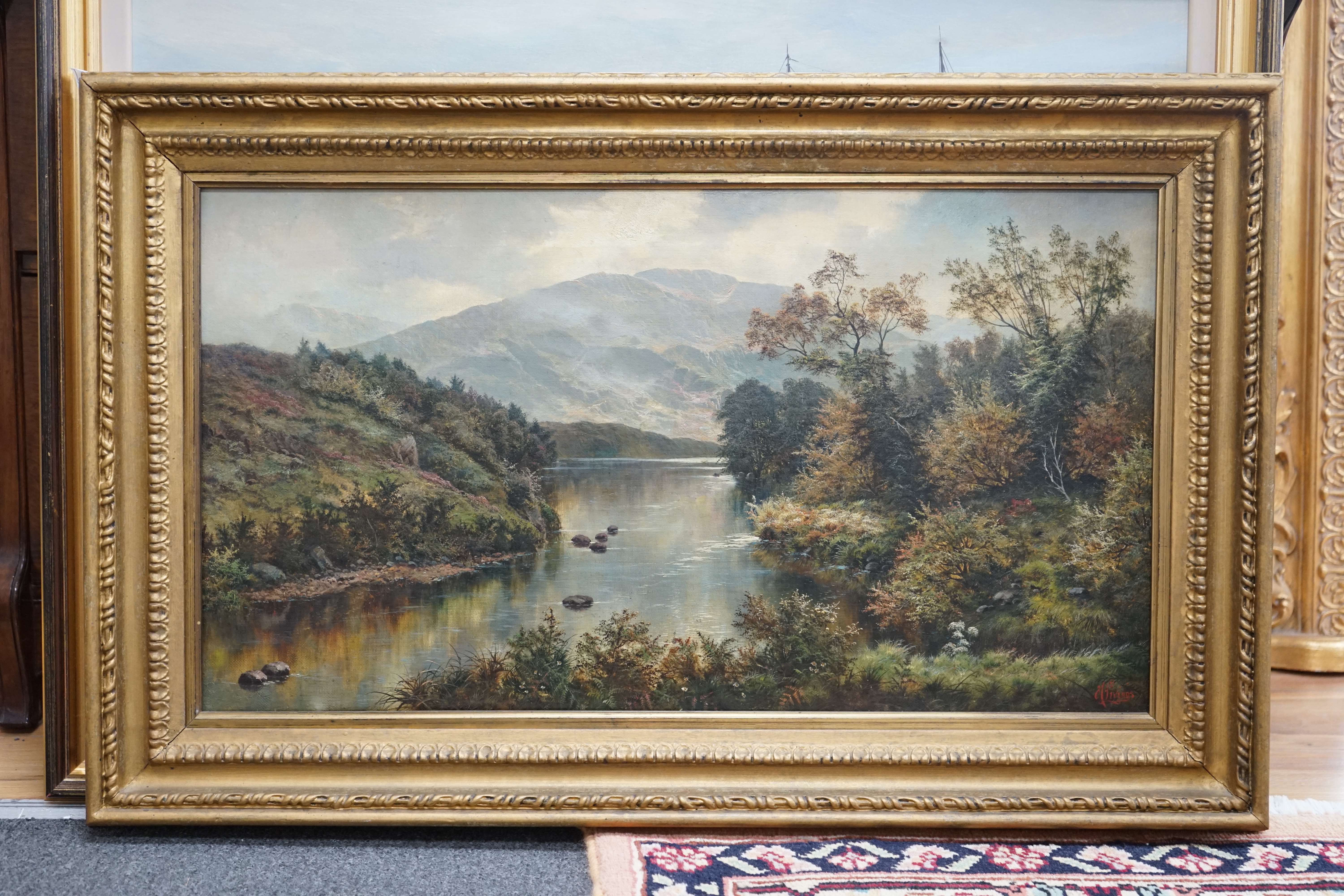Henry Livings (1850-1950), oil on canvas, Mountainous riverscape, signed, 38 x 68cm, gilt framed. Condition - good